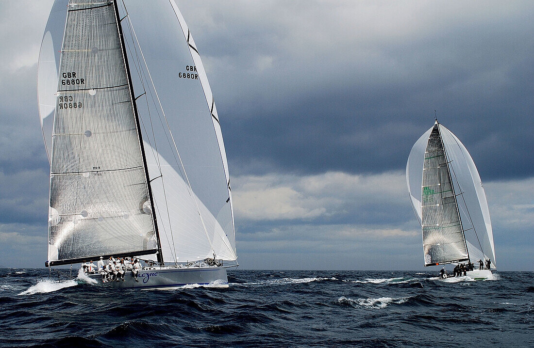 two sailing boats racing in cork week. sailing outside cork harbour, on a beatiful summers day