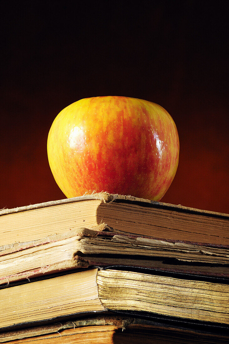 Apple on stack of books