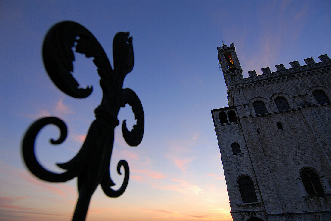 Gubbio Umbria Italy Palazzo dei Consoli and the wrought iron Fleur de Lys,  a motif found throughout the town