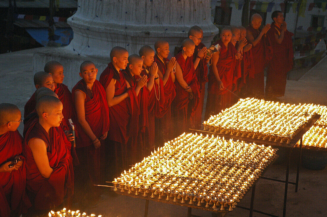 Monks and butter candles at Boudhanath,  Nepal