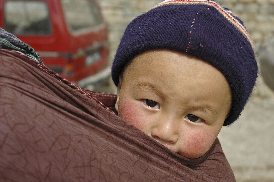 Tibetan baby in a sling Lama Yuru,  Ladakh,  India