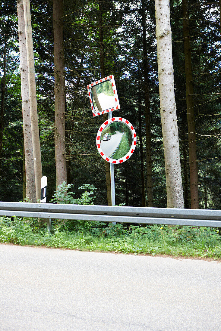 Two traffic mirrors beside a street, Black Forest, Baden-Wuerttemberg, Germany