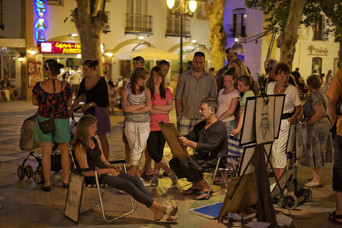 Caricaturist on main square, Nerja, Andalusia, Spain