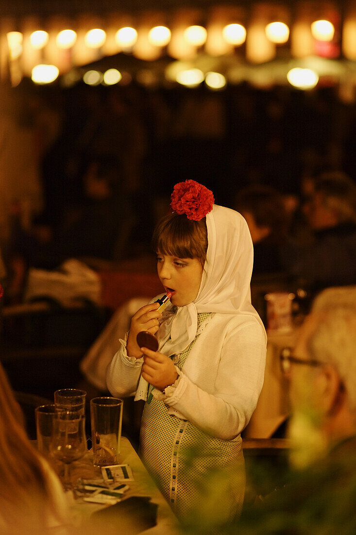 Girl wearing traditonal costume, Plaza Mayor, Fiestas de San Isidro Labrador, Madrid, Spain