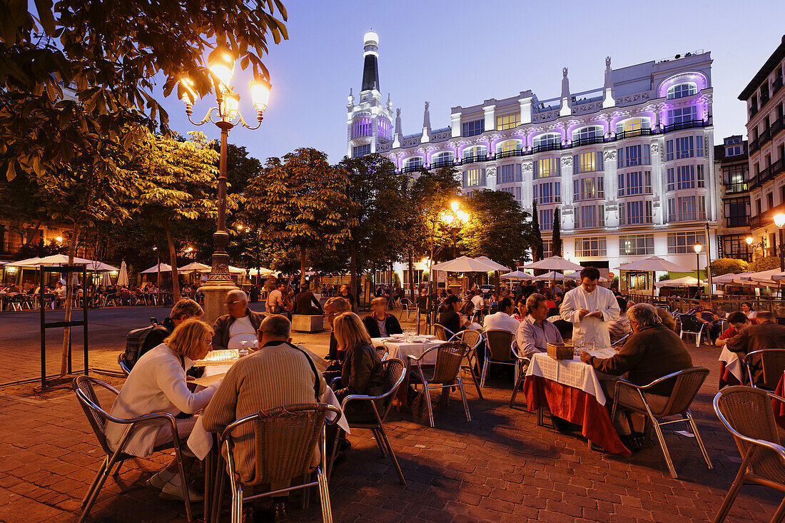 Pavement cafes Placa Sant Ana in the evening, Hotel Me Madrid Reina Victoria in background, Calle de Huertas, Madrid, Spain
