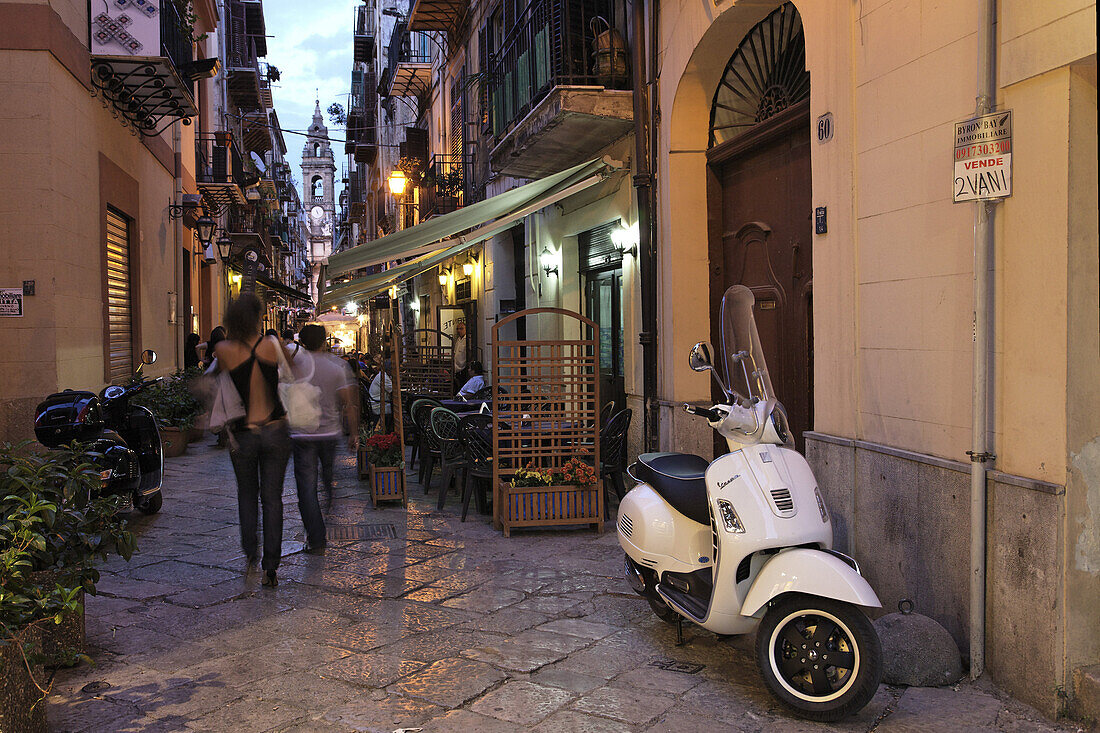 View along a street to spire near Piazza Olivella, Palermo, Sicily, Italy