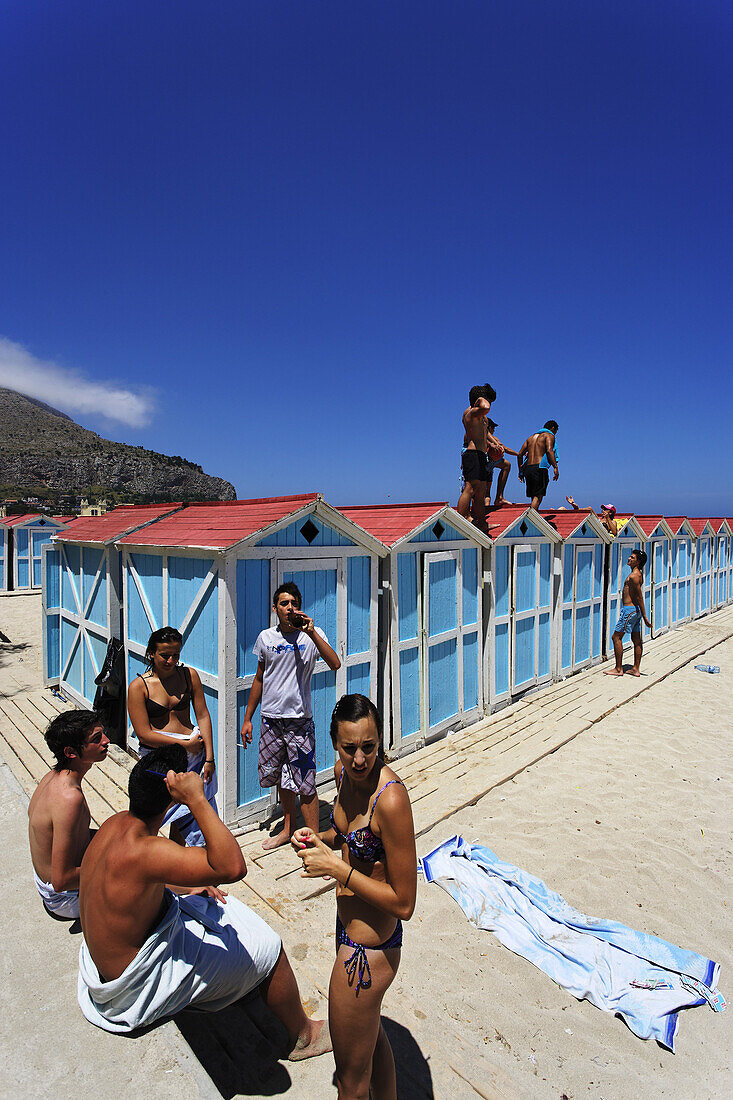 Young people at beach, Mondello, Palermo, Sicily, Italy