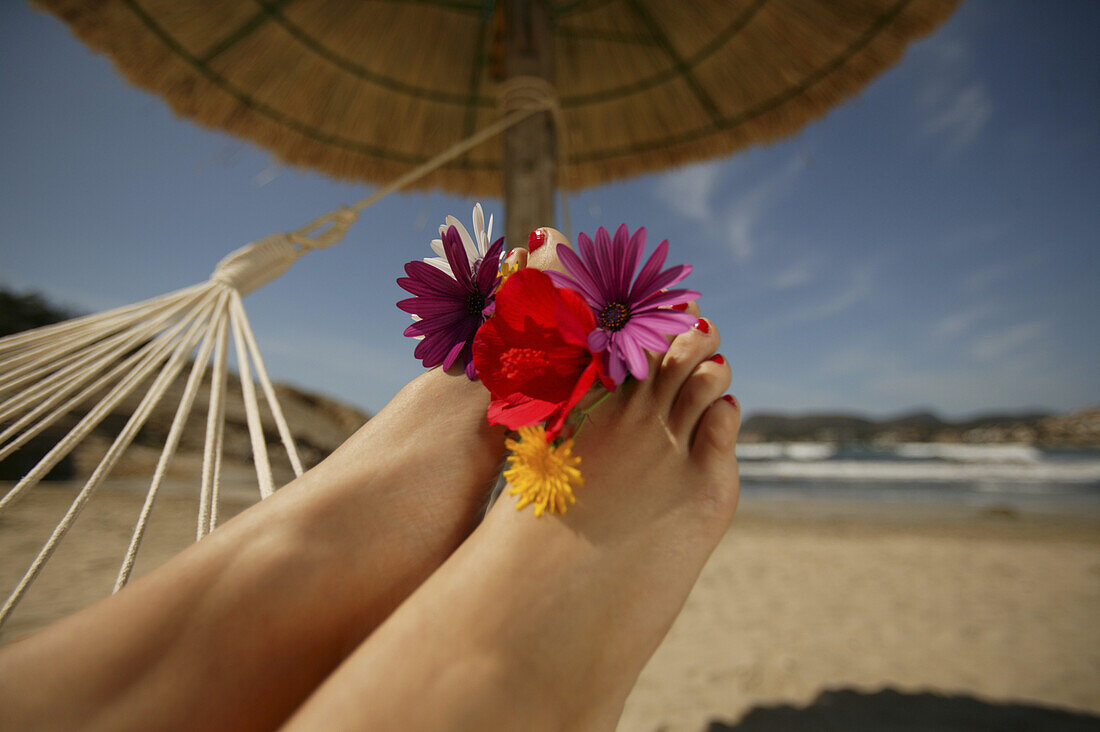 Woman's feet with flowers