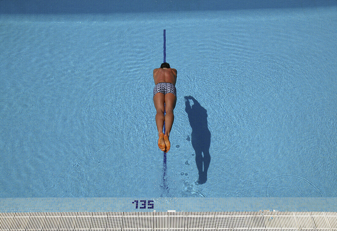 Man jumping into water