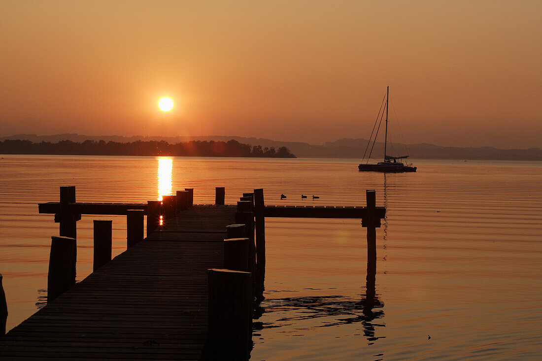 Sunset over lake Chiemsee, Feldwies, Chiemgau, Bavaria, Germany