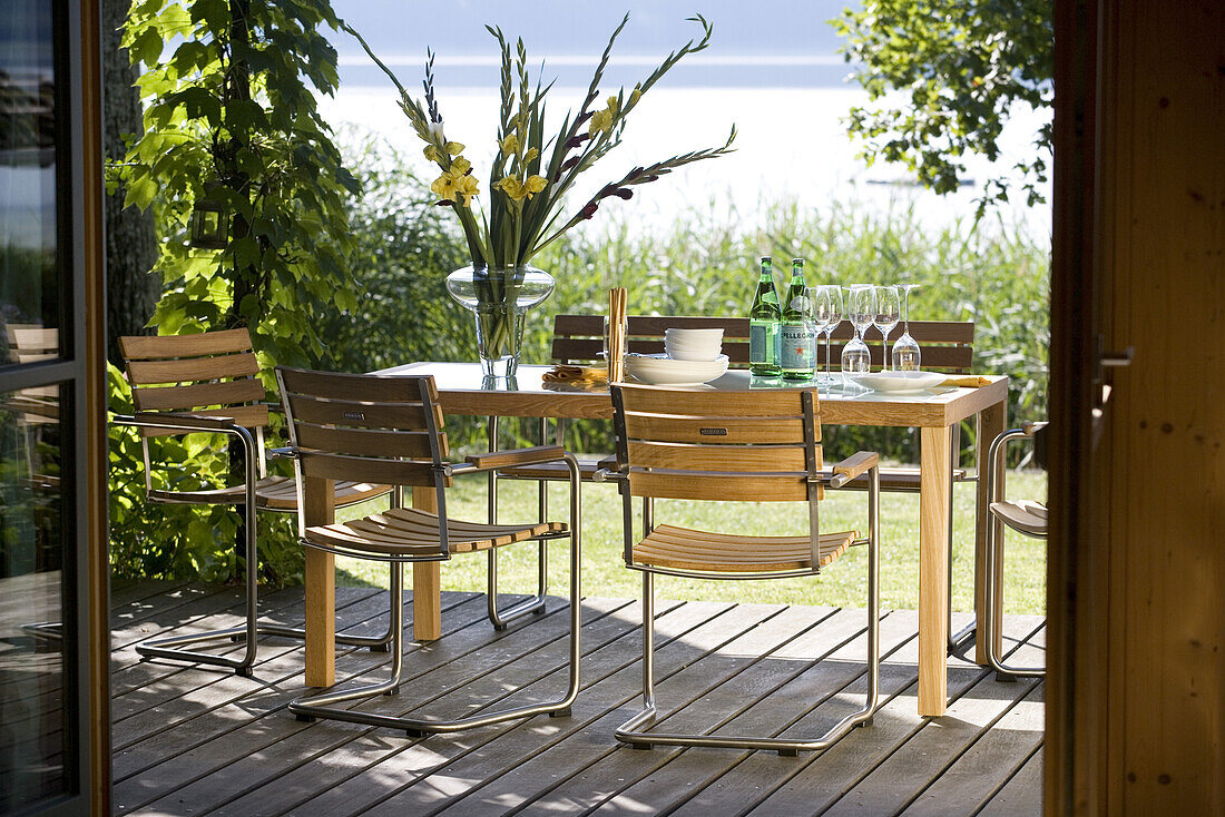 Terrace with outdoor furniture, Lake Simssee, Bavaria, Germany