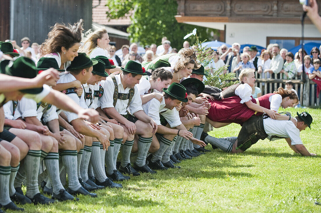 Young people wearing traditional costumes, May Running, Antdorf, Upper Bavaria, Germany