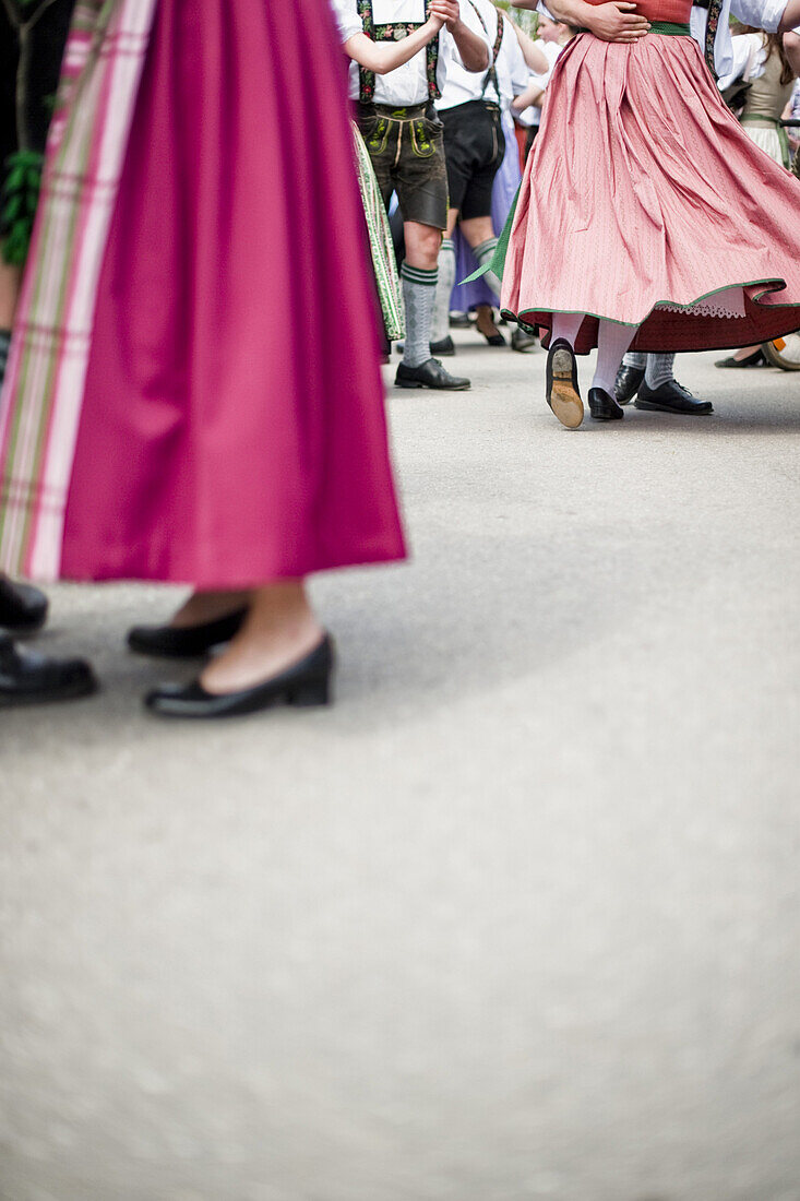 Couples wearing traditional costumes dancing, May Running, Antdorf, Upper Bavaria, Germany