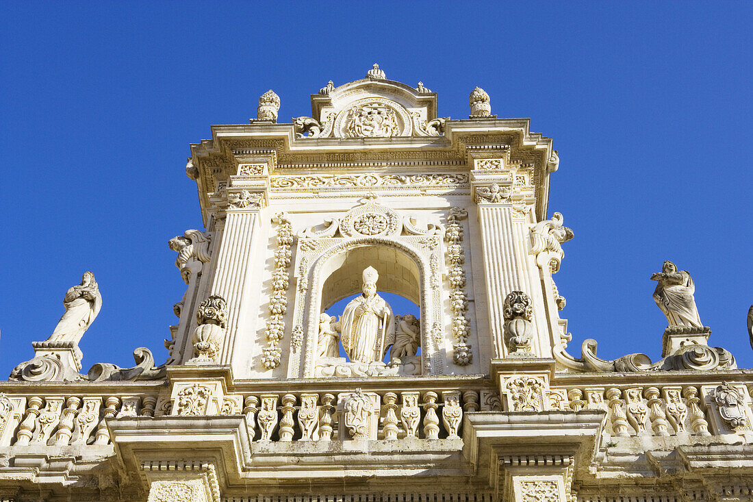 Decorated facade over the entrance to the cathedral, Lecce, Puglia, Italy
