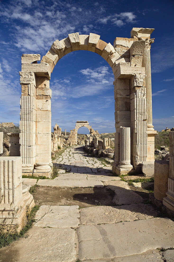 The Arch of Trajan on Via Trionfale, Arch of Tiberius in the background, Leptis Magna, Libya, Africa