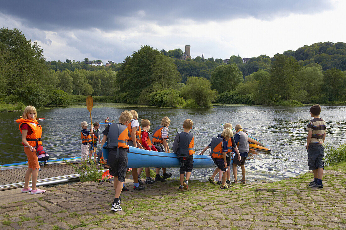 Children with canoe, Bochum-Stiepel, North Rhine-Westphalia, Germany