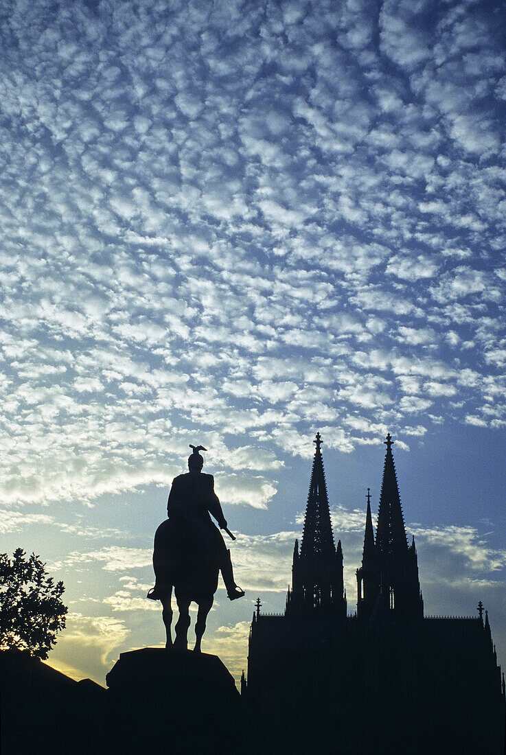 Cologne Cathedral and Hohenzollern Bridge with equestrian sculpture, Cologne, Rhine river, North Rhine-Westphalia, Germany