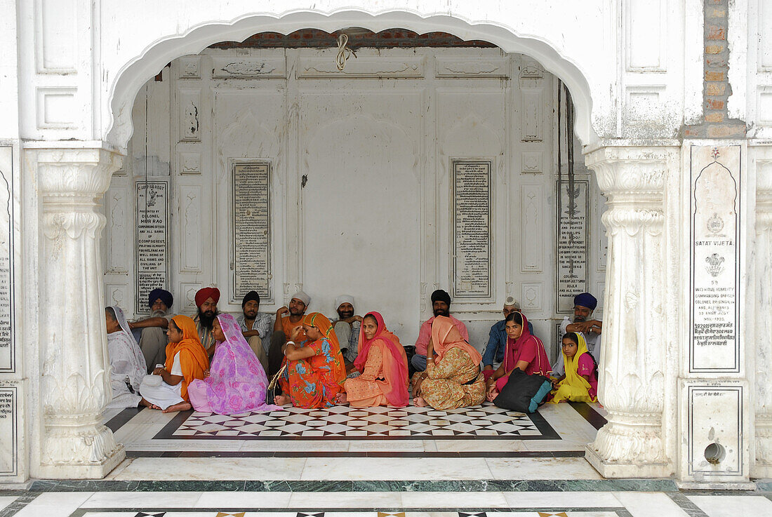 Golden Temple, Sikh holy place, pilgrims sitting in the arcades, Amritsar, Punjab, India, Asia