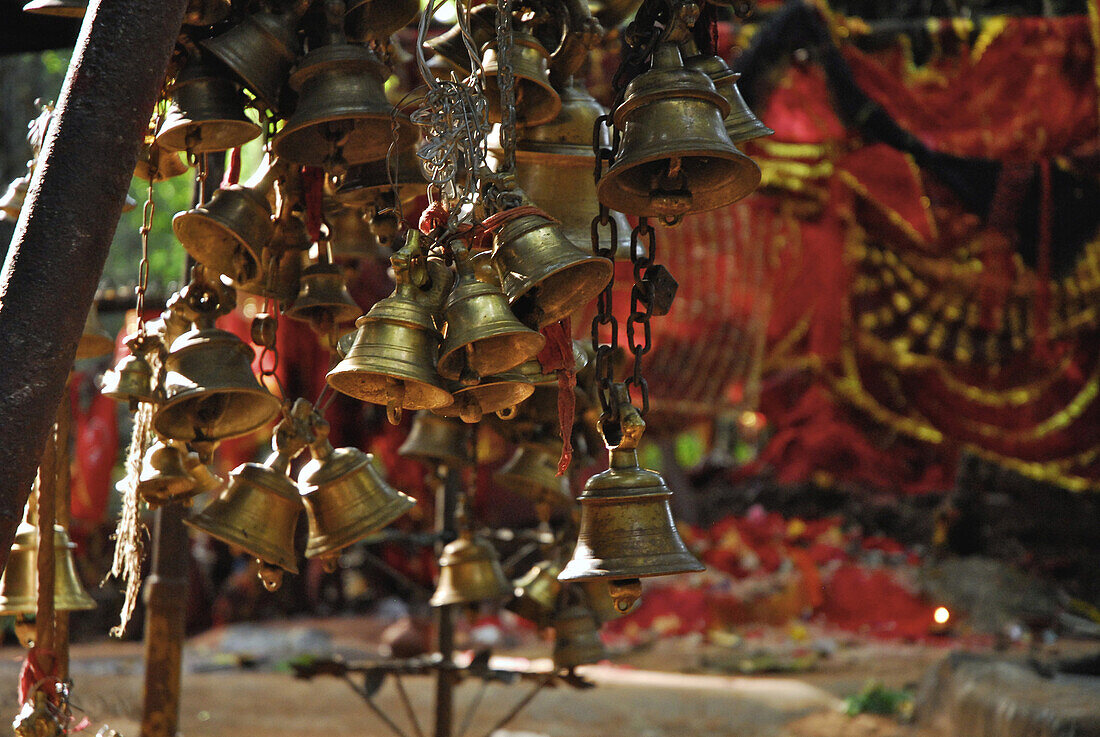 Bells at local holy site in the forest, Tribal region in Koraput district in southern Orissa, India, Asia