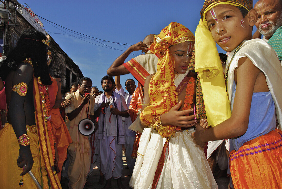 Dancing pilgrims and boys in front of the Jagannath Temple, Puri, Orissa, India, Asia