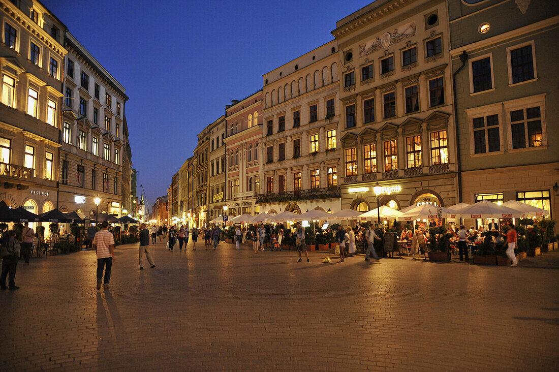 Rynek glowny, market place with street cafes in the evening, Krakow, Poland, Europe