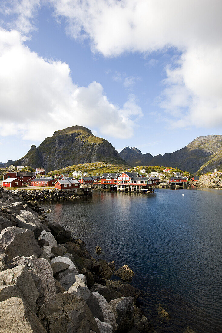 Rorbu huts on the waterfront under clouded sky, Lofoten, Norway, Scandinavia, Europe