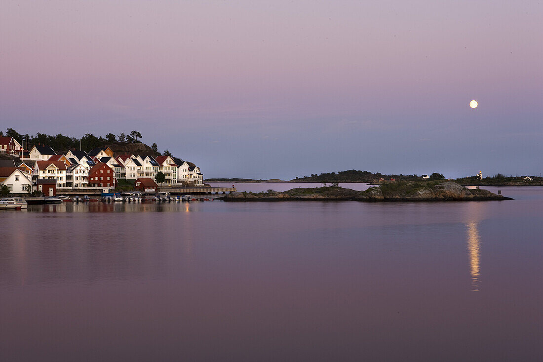 Houses at skerry coastline at sunset, Skagerrak, Sorland, Norway, Scandinavia, Europe