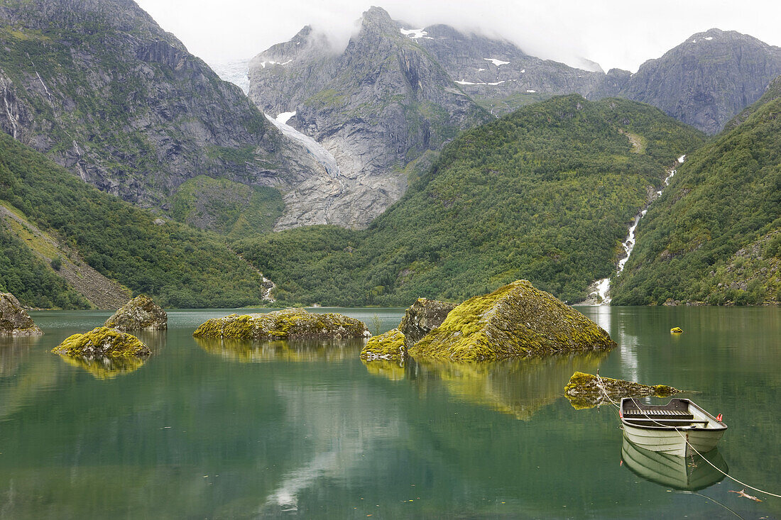 View at the glacier Bonhusbrea with the green sea Bondhusvatnet and boat in the foreground, Sunndal, Folgefonn peninsula, Kvinnherad, Hordaland, Norway, Scandinavia, Europe