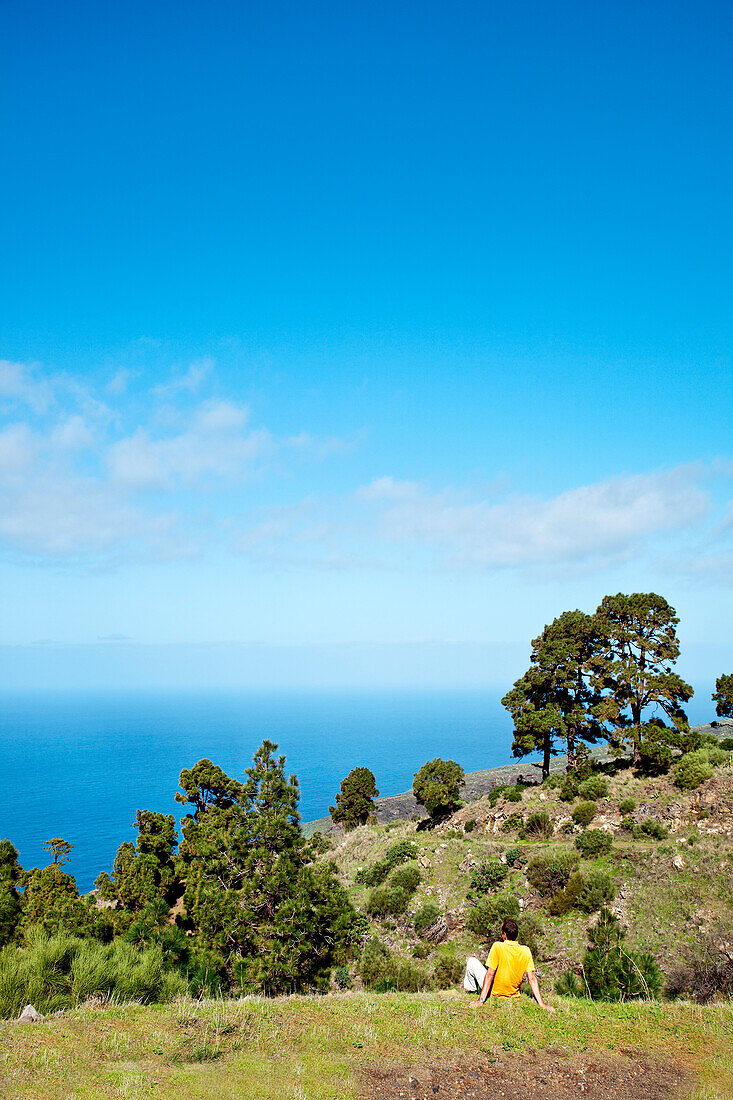 Man looking at the landscape and the sea, La Palma, Canary Islands, Spain, Europe