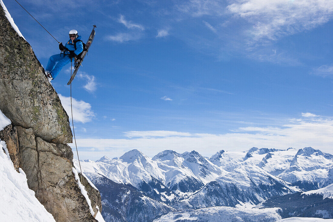 Skier rappeling, Disentis, Surselva, Grisons, Switzerland