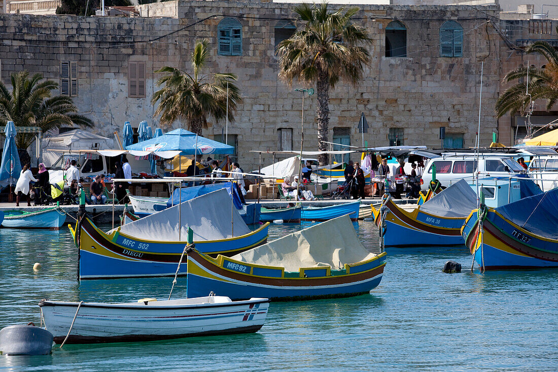 The traditional maltese fishing boats, the Luzzus at harbour, Marsaxlokk, Malta, Europe