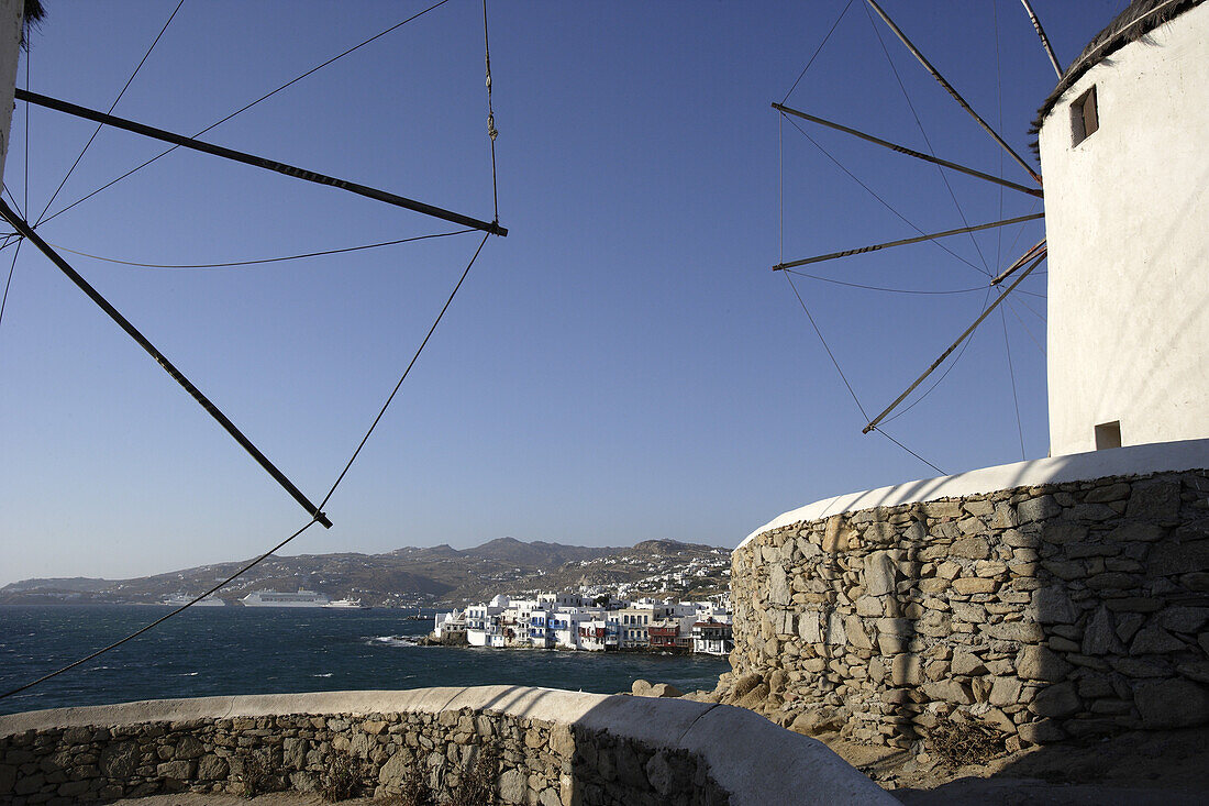 Windmills at the coast in the sunlight, Mykonos, Greece, Europe