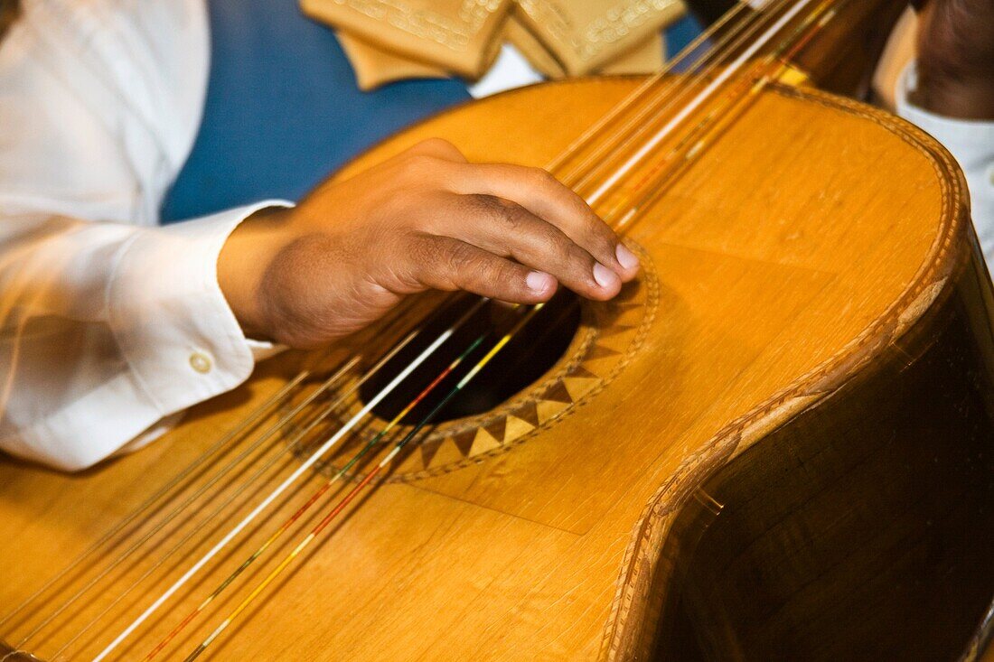 Tequilla, Jalsico, Mexico  Muscian Playing guitar in mariachi band