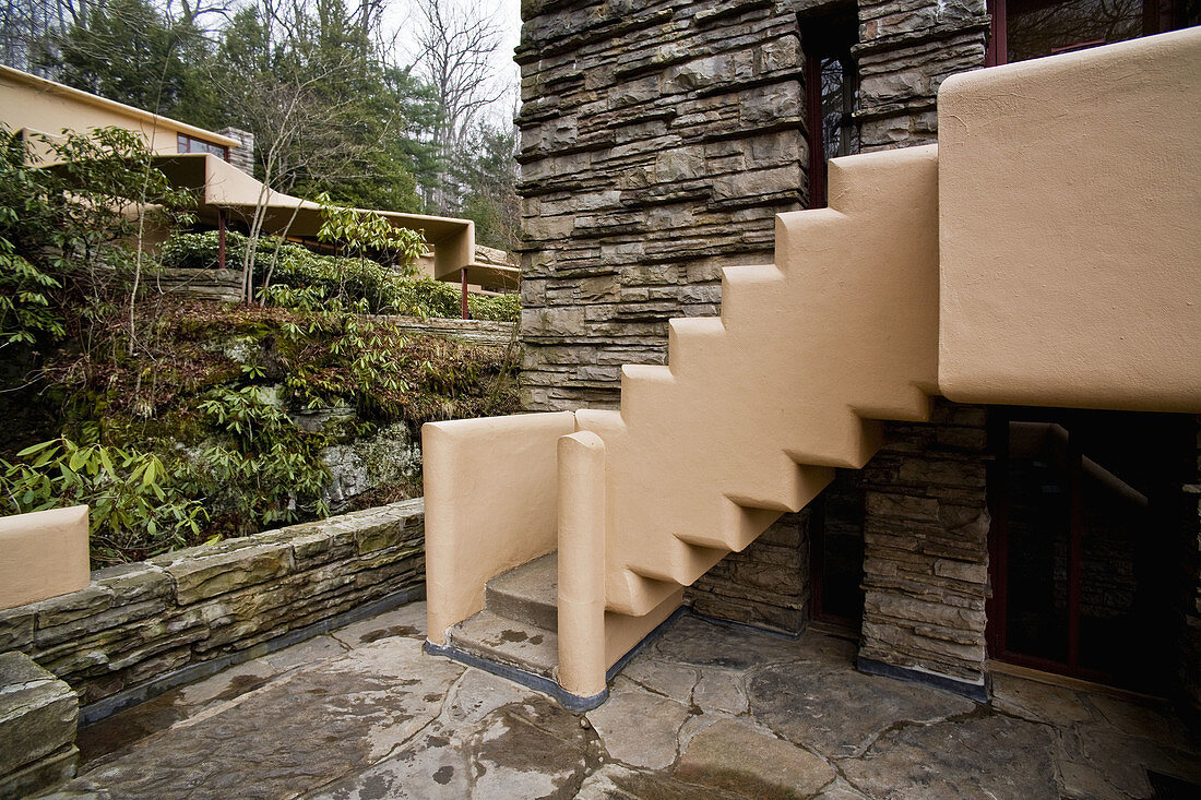 The penthouse stairs and guest house stair canopy at Fallingwater share the same design motif, derived from Native American pueblos  Also known as the Edgar J  Kaufmann Sr  Residence, Fallingwater was designed by American architect Frank Lloyd Wright in 1