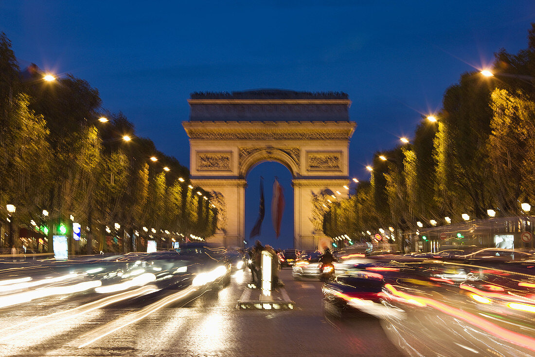 Arc de Triomphe from the Champs Elysees at dusk, motion blur, Paris, France