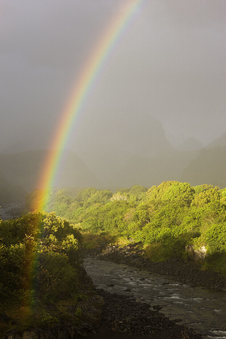 Riviere du Mat river valley and rainbow, Cirque de Salazie, Reunion island, France
