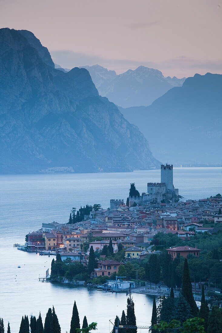 Italy, Veneto, Lake District, Lake Garda, Malcesine, aerial town view, dawn