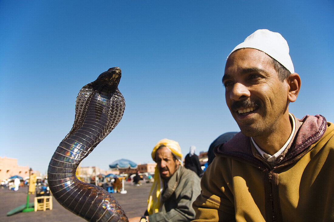 Snake charmer in Jemaa el Fna square, Marrakech, Morocco