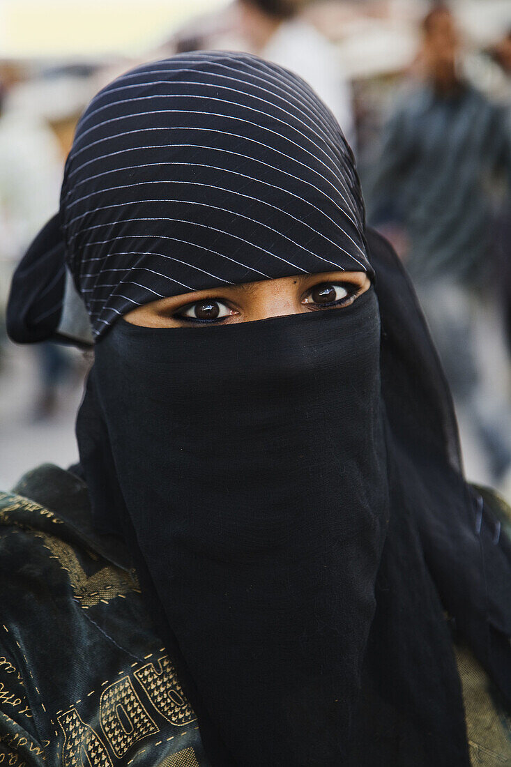Muslim woman in Jemaa el Fna square, Marrakech, Morocco