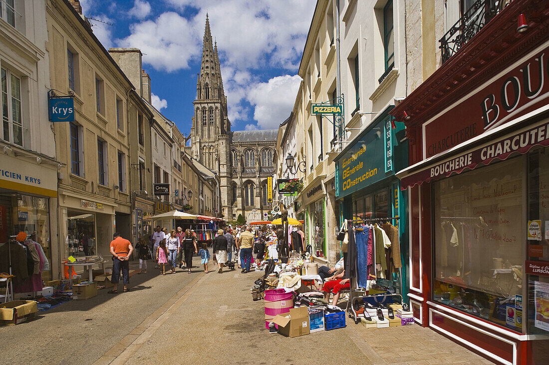 Street market and Notre Dame Cathedral in background on 14 July  French national holiday), Sees. Orne, Basse-Normandie, France