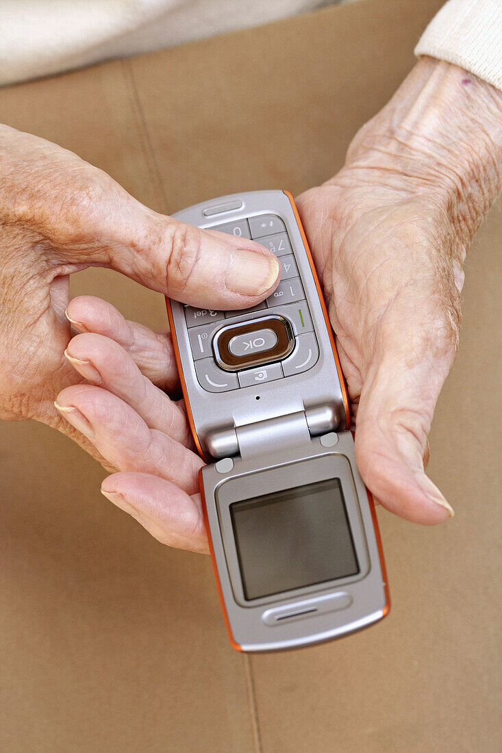 Elderly woman with cellular phone