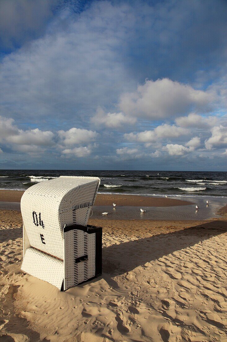 single roofed wicker beach chair at the sandy coast of the isle of Usedom, Western Pomerania, Germany, Europe