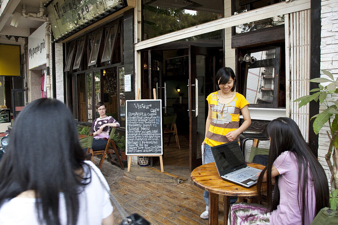 People in front of Vintage Cafe, Kunming, Yunnan, People's Republic of China, Asia