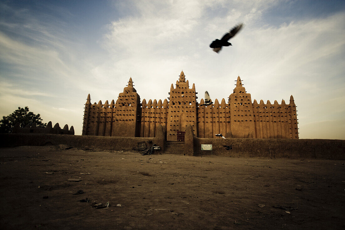 Mosque of Djenna under clouded sky, Mali, Africa