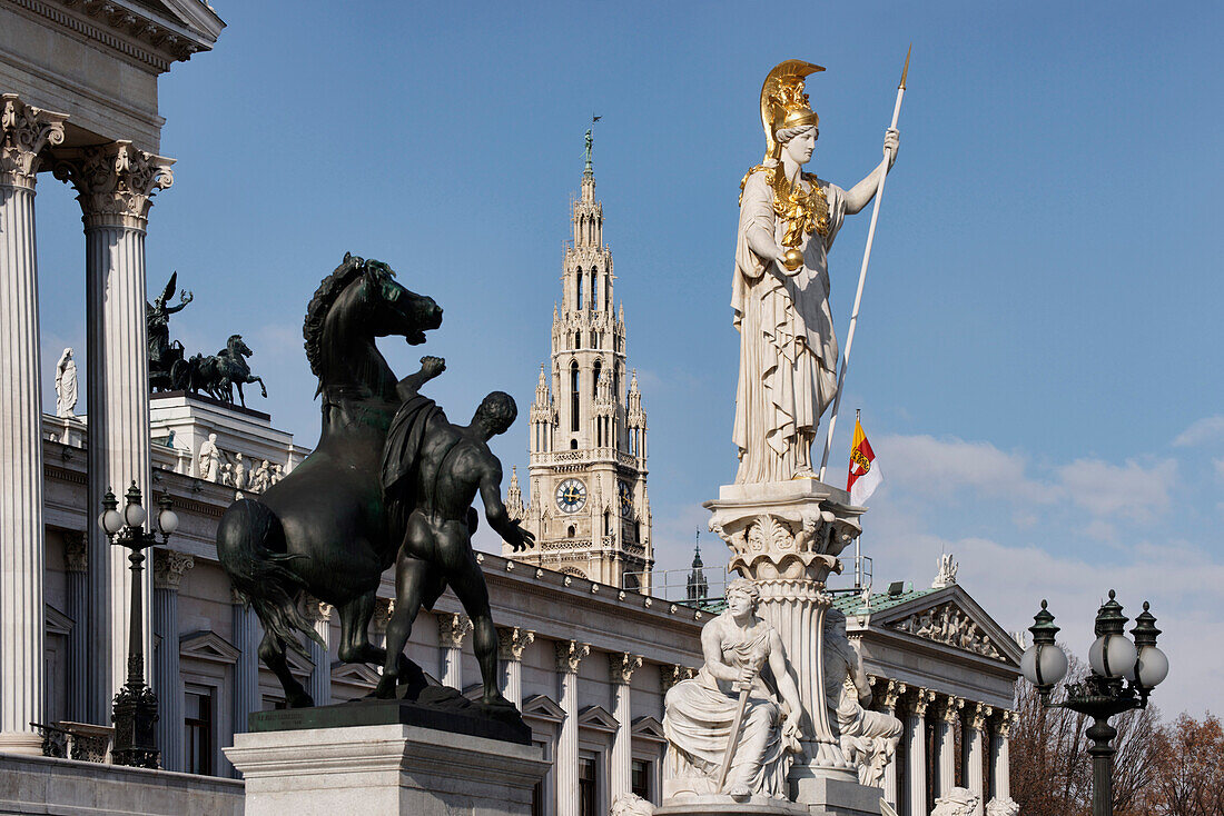 Sculptures, Bronze horse tamer and Pallas Athene in front of the Austrian Parliament building, Town Hall in the background, Vienna, Austria