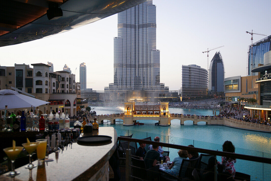 People in a bar in front of Burj Khalifa, Burj Chalifa at dusk, Dubai, UAE, United Arab Emirates, Middle East, Asia