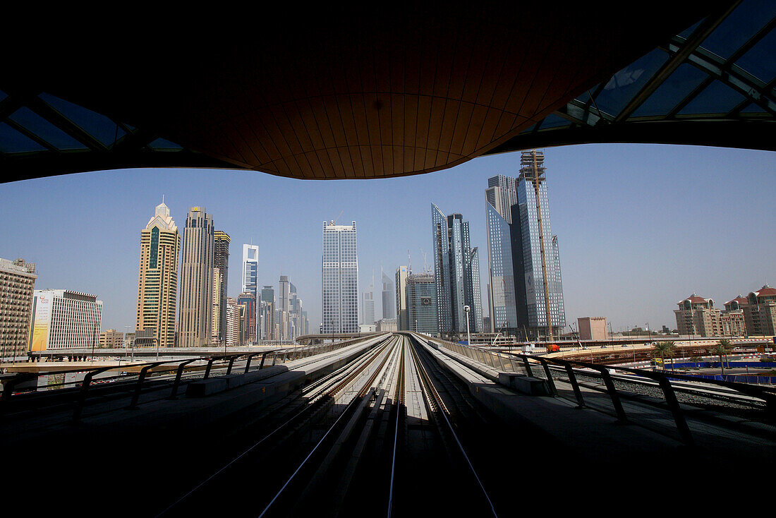 Subway, tracks between high rise buildings at Sheikh Zayed Road, Dubai, UAE, United Arab Emirates, Middle East, Asia