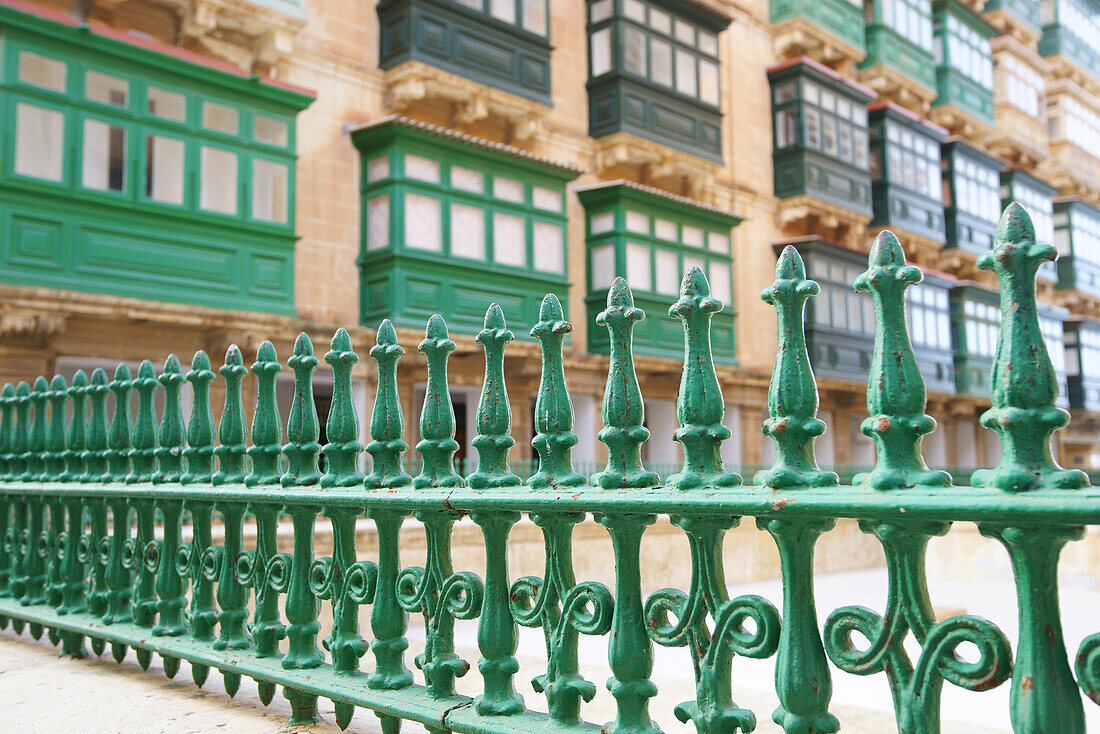 Green railing and houses with oriels, Valletta, Malta, Europe