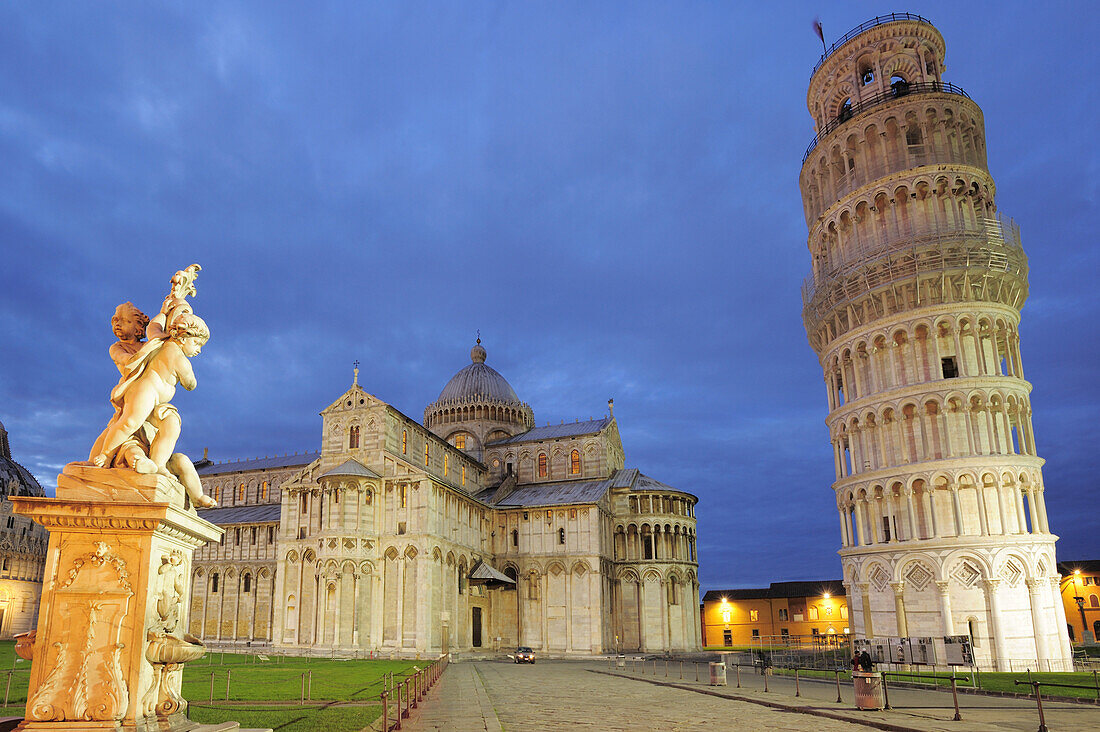 Illuminated Leaning tower of Pisa and cathedral, fountain in foreground, Pisa, UNESCO world heritage site, Tuscany, Italy