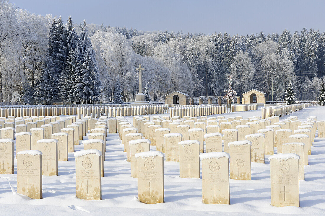 Snow covered graves and cross in Durnbach war cemetery, lake Tegernsee, Duernbach, Upper Bavaria, Bavaria, Germany